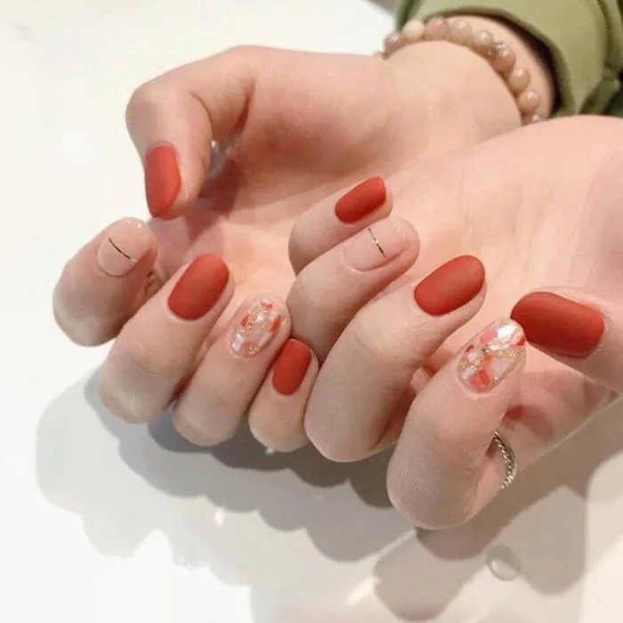 Sơn móng tay màu cam đất có những màu nào? Phù hợp với tông da nào? |  websosanh.vn